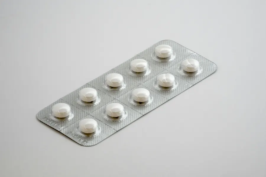 Blister pack of tablets on a plain background